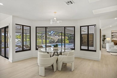 Discover refined luxury in this fully renovated 4,542 total sq on PGA National Golf Club in Florida - for sale on GolfHomes.com, golf home, golf lot