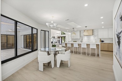 Discover refined luxury in this fully renovated 4,542 total sq on PGA National Golf Club in Florida - for sale on GolfHomes.com, golf home, golf lot