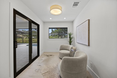 Discover refined luxury in this fully renovated 4,542 total sq on PGA National Golf Club in Florida - for sale on GolfHomes.com, golf home, golf lot