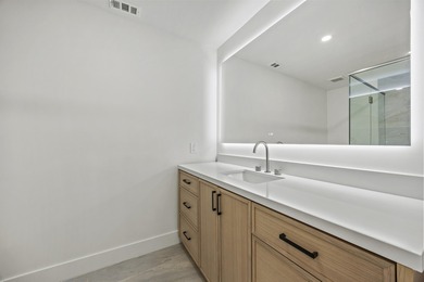 Discover refined luxury in this fully renovated 4,542 total sq on PGA National Golf Club in Florida - for sale on GolfHomes.com, golf home, golf lot