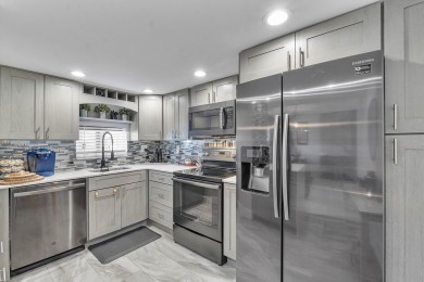 PHASE II - GORGEOUS FIRST FLOOR 1BR/1.5 BA UNIT. FULLY on Hollybrook Golf and Tennis Club  in Florida - for sale on GolfHomes.com, golf home, golf lot