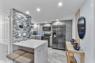 PHASE II - GORGEOUS FIRST FLOOR 1BR/1.5 BA UNIT. FULLY on Hollybrook Golf and Tennis Club  in Florida - for sale on GolfHomes.com, golf home, golf lot