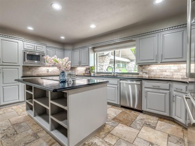 Welcome to this stunning custom home with 5,488 sqft of living on Oak Tree National Golf and Country Club in Oklahoma - for sale on GolfHomes.com, golf home, golf lot