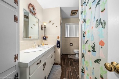 Welcome to your private retreat! This charming 3-bedroom on Ben Geren Regional Park Golf Courses in Arkansas - for sale on GolfHomes.com, golf home, golf lot