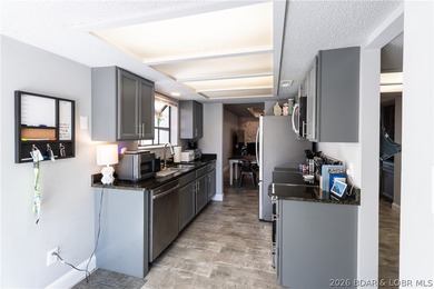 Completely remodeled and ideally located in the heart of Lake of on Seasons Ridge At Four Seasons in Missouri - for sale on GolfHomes.com, golf home, golf lot