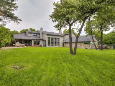 Welcome to this stunning custom home with 5,488 sqft of living on Oak Tree National Golf and Country Club in Oklahoma - for sale on GolfHomes.com, golf home, golf lot