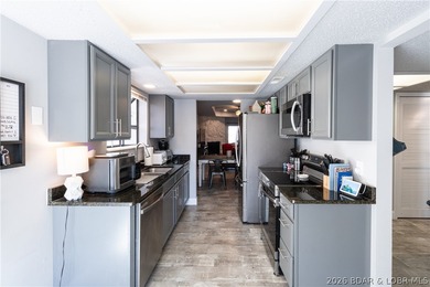 Completely remodeled and ideally located in the heart of Lake of on Seasons Ridge At Four Seasons in Missouri - for sale on GolfHomes.com, golf home, golf lot