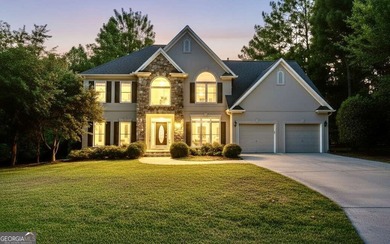 Step into luxury with this beautifully maintained two-story on Towne Lake Hills Golf Club in Georgia - for sale on GolfHomes.com, golf home, golf lot