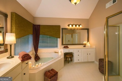 Step into luxury with this beautifully maintained two-story on Towne Lake Hills Golf Club in Georgia - for sale on GolfHomes.com, golf home, golf lot