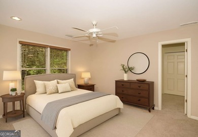 Step into luxury with this beautifully maintained two-story on Towne Lake Hills Golf Club in Georgia - for sale on GolfHomes.com, golf home, golf lot