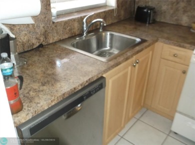 LOVELY 2 BEDROOM 2 BATH CONDO IN FABULOUS SUNRISE LAKES PHASE 3 on Sunrise Lakes Phase III in Florida - for sale on GolfHomes.com, golf home, golf lot
