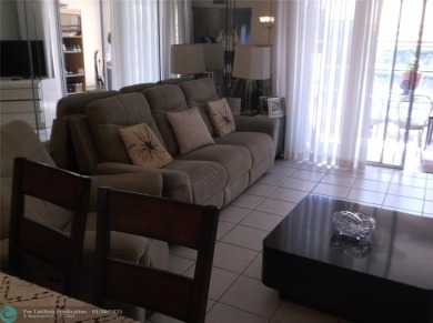LOVELY 2 BEDROOM 2 BATH CONDO IN FABULOUS SUNRISE LAKES PHASE 3 on Sunrise Lakes Phase III in Florida - for sale on GolfHomes.com, golf home, golf lot
