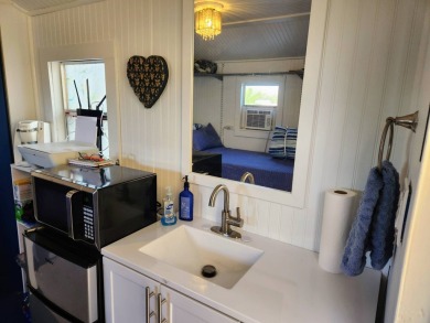 This primo lot in the luxury motorcoach section is once again on Deer Creek RV Golf Resort in Florida - for sale on GolfHomes.com, golf home, golf lot