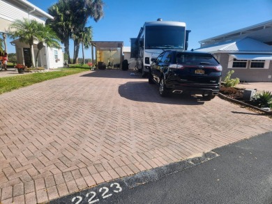 This primo lot in the luxury motorcoach section is once again on Deer Creek RV Golf Resort in Florida - for sale on GolfHomes.com, golf home, golf lot
