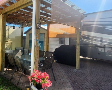 This primo lot in the luxury motorcoach section is once again on Deer Creek RV Golf Resort in Florida - for sale on GolfHomes.com, golf home, golf lot