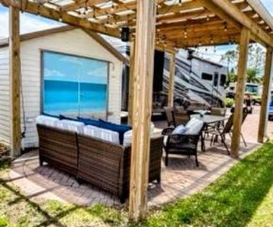 This primo lot in the luxury motorcoach section is once again on Deer Creek RV Golf Resort in Florida - for sale on GolfHomes.com, golf home, golf lot