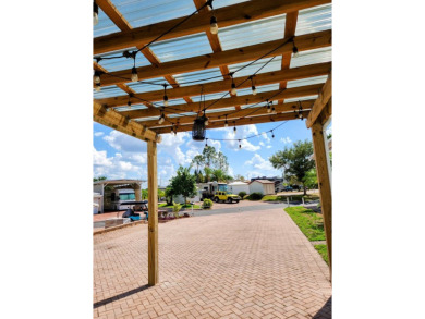 This primo lot in the luxury motorcoach section is once again on Deer Creek RV Golf Resort in Florida - for sale on GolfHomes.com, golf home, golf lot