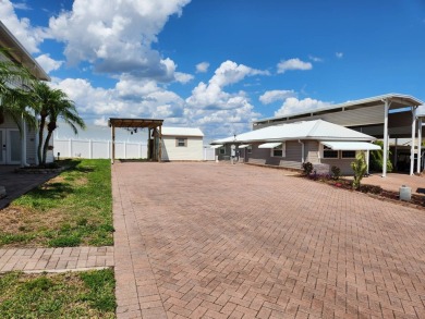 This primo lot in the luxury motorcoach section is once again on Deer Creek RV Golf Resort in Florida - for sale on GolfHomes.com, golf home, golf lot