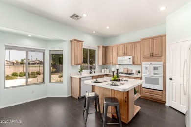This pristine home offers rare golf course frontage in both the on Greenfield Lakes Golf Club in Arizona - for sale on GolfHomes.com, golf home, golf lot