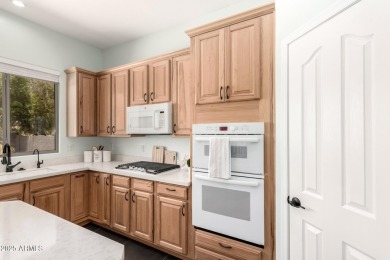 This pristine home offers rare golf course frontage in both the on Greenfield Lakes Golf Club in Arizona - for sale on GolfHomes.com, golf home, golf lot