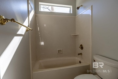 STUNNING WATERFRONT LIVING IN ROCK CREEK! Beautifully designed on Rock Creek Golf Club in Alabama - for sale on GolfHomes.com, golf home, golf lot