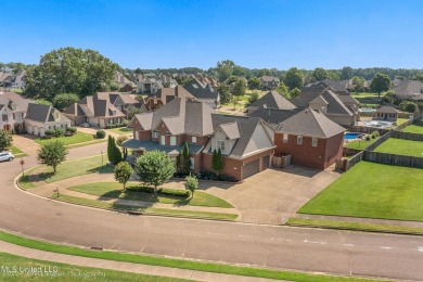 Are you looking for a family oasis perfect for entertaining? on Cherokee Valley Golf Course in Mississippi - for sale on GolfHomes.com, golf home, golf lot