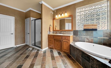 This 4-bedroom, 2.5-bathroom home features a spacious living on Twin Rivers Golf Club in Texas - for sale on GolfHomes.com, golf home, golf lot