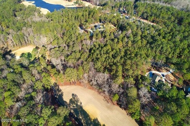 Level golf front home site is gently wooded with lovely tree on Forest Creek Golf Club  in North Carolina - for sale on GolfHomes.com, golf home, golf lot