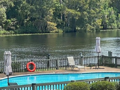 Welcome to your dream waterfront condo just steps away from the on Beau Chene Country Club in Louisiana - for sale on GolfHomes.com, golf home, golf lot