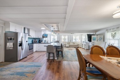 Discover your slice of paradise in this beautifully updated on Pelicans Nest Golf Club in Florida - for sale on GolfHomes.com, golf home, golf lot