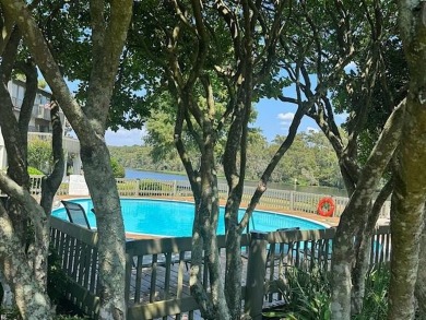 Welcome to your dream waterfront condo just steps away from the on Beau Chene Country Club in Louisiana - for sale on GolfHomes.com, golf home, golf lot