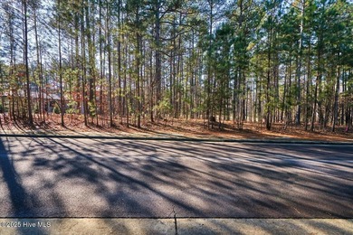 Level golf front home site is gently wooded with lovely tree on Forest Creek Golf Club  in North Carolina - for sale on GolfHomes.com, golf home, golf lot