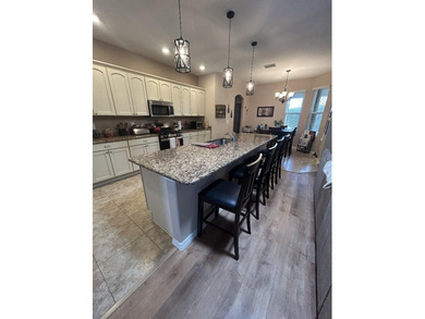 Beautifully maintained 4/3 with an office, brand new roof on Arlington Ridge Golf Club in Florida - for sale on GolfHomes.com, golf home, golf lot