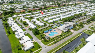 Your Florida oasis awaits here at Palm Beach Leisureville! This on Leisureville Community Golf Course in Florida - for sale on GolfHomes.com, golf home, golf lot