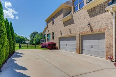 Discover unparalleled luxury at 1776 Traditions Way, an on Traditions of Braselton Golf Club in Georgia - for sale on GolfHomes.com, golf home, golf lot