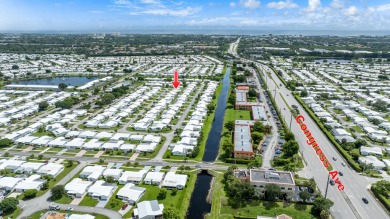 Your Florida oasis awaits here at Palm Beach Leisureville! This on Leisureville Community Golf Course in Florida - for sale on GolfHomes.com, golf home, golf lot