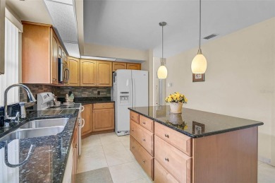 Discover this well-maintained 3BR/2BA Patio home with a private on Peridia Golf and Country Club in Florida - for sale on GolfHomes.com, golf home, golf lot