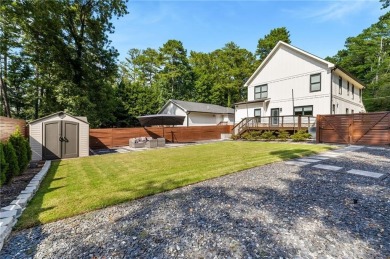 Welcome to this meticulously crafted modern farmhouse, crafted on East Lake Golf Club in Georgia - for sale on GolfHomes.com, golf home, golf lot