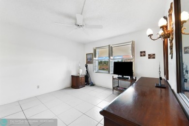 Welcome to this spacious 2-bed, 2-bath condo in the heart of on Sunrise Lakes Phase III in Florida - for sale on GolfHomes.com, golf home, golf lot