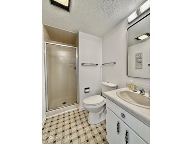 This first floor St. Andrews 2-bedroom, 2-bathroom lakefront on Pinehurst Resort and Country Club in North Carolina - for sale on GolfHomes.com, golf home, golf lot