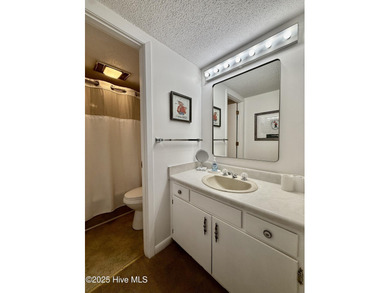 This first floor St. Andrews 2-bedroom, 2-bathroom lakefront on Pinehurst Resort and Country Club in North Carolina - for sale on GolfHomes.com, golf home, golf lot