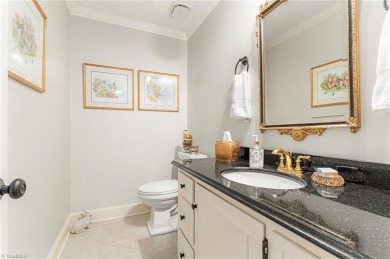 Situated on the 14th green of the newly renovated Forest Oaks on Forest Oaks Country Club in North Carolina - for sale on GolfHomes.com, golf home, golf lot