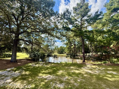 This first floor St. Andrews 2-bedroom, 2-bathroom lakefront on Pinehurst Resort and Country Club in North Carolina - for sale on GolfHomes.com, golf home, golf lot