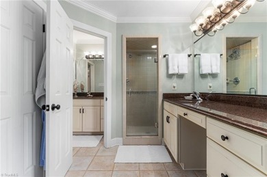 Situated on the 14th green of the newly renovated Forest Oaks on Forest Oaks Country Club in North Carolina - for sale on GolfHomes.com, golf home, golf lot