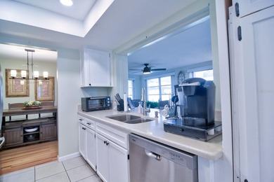 LOCATION, location, location! Welcome home to the highly on Mainlands Golf Club in Florida - for sale on GolfHomes.com, golf home, golf lot