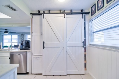 LOCATION, location, location! Welcome home to the highly on Mainlands Golf Club in Florida - for sale on GolfHomes.com, golf home, golf lot