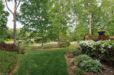 Situated on the 14th green of the newly renovated Forest Oaks on Forest Oaks Country Club in North Carolina - for sale on GolfHomes.com, golf home, golf lot