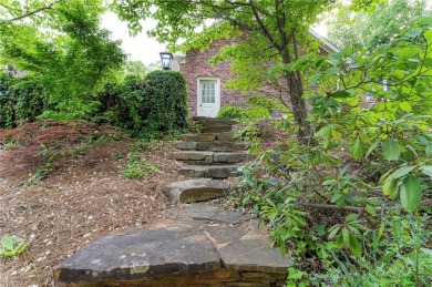Situated on the 14th green of the newly renovated Forest Oaks on Forest Oaks Country Club in North Carolina - for sale on GolfHomes.com, golf home, golf lot