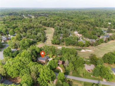 Situated on the 14th green of the newly renovated Forest Oaks on Forest Oaks Country Club in North Carolina - for sale on GolfHomes.com, golf home, golf lot
