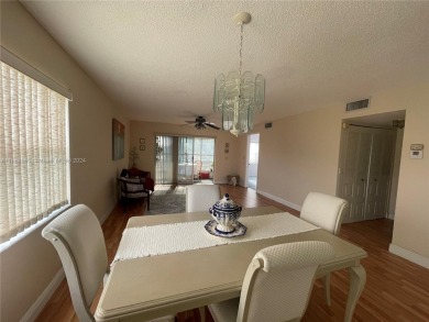 This  55+ Resort like 2 bedroom 2 bath corner unit offers on Sunrise Lakes Phase III in Florida - for sale on GolfHomes.com, golf home, golf lot